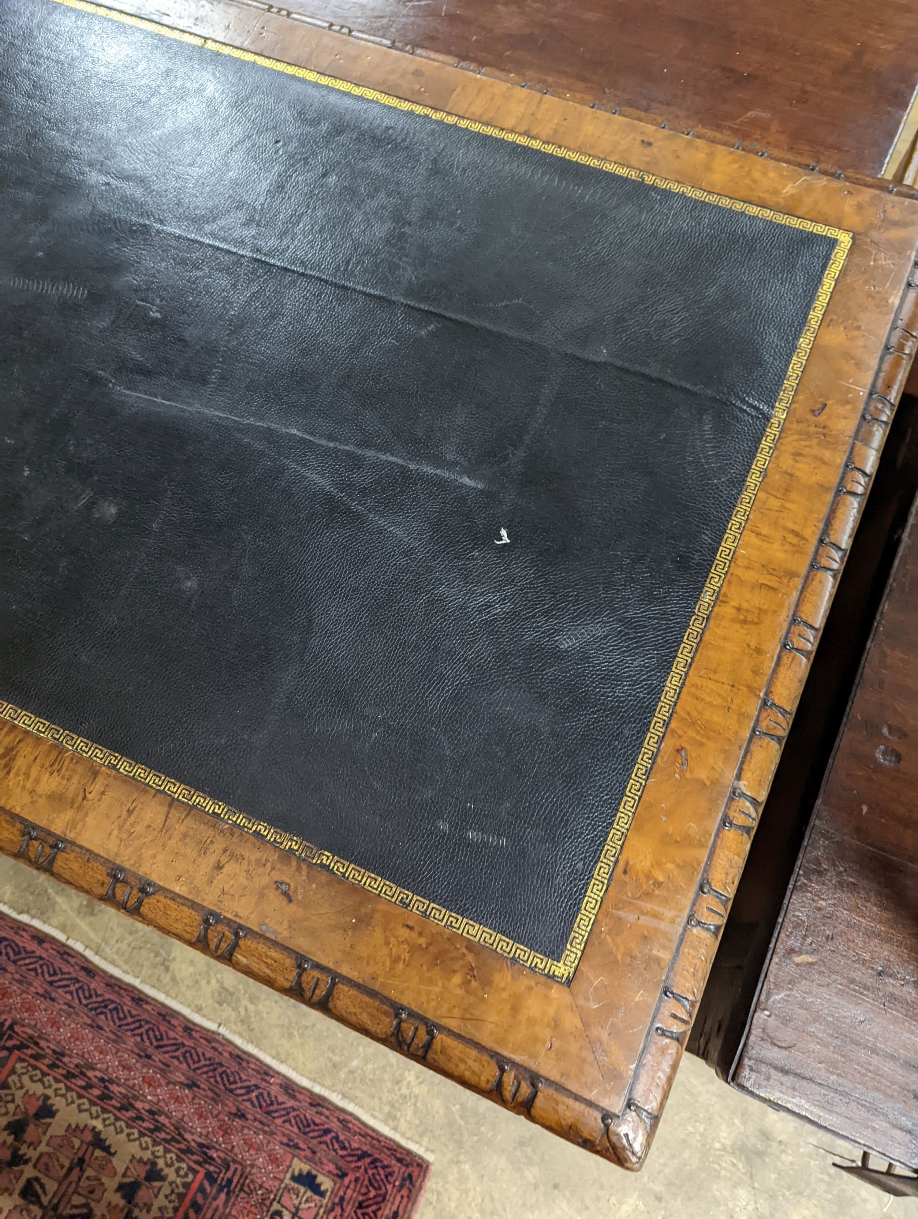 A Victorian Gothic style walnut two drawer library table, width 152cm, depth 78cm, height 76cm